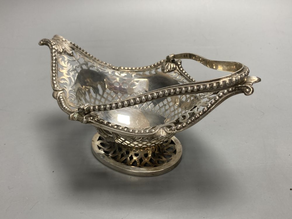A late Victorian pierced silver boat shaped bonbon basket, Charles Stuart Harris, London, 1890, width 17cm, 7oz.